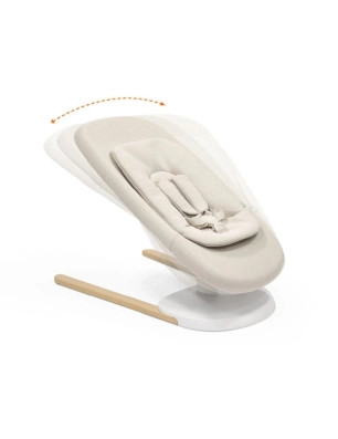 Hamaca Yoga de Stokke en movimiento con flecha curva que indica el balanceo hacia los lados.