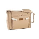 Trona de Viaje Avant de Jané U85 Sesame plegada como bolso, con correa de hombro y bolsillo exterior